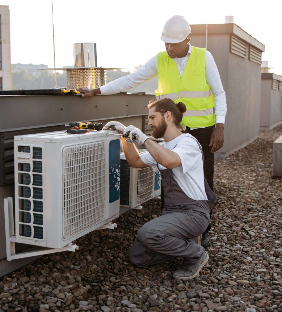 diverse plant workers repairing air conditioner on 2023 12 21 22 00 43 utc scaled 1 1536x1024 1